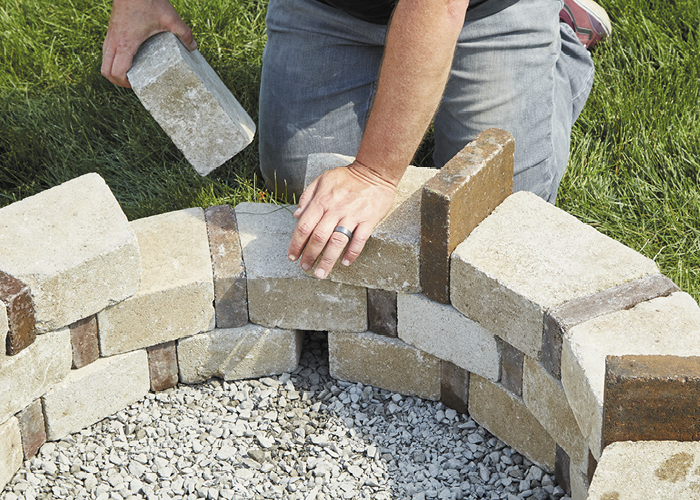 DIY firepit9:You'll want to secure the top course with landscape adhesive as well.