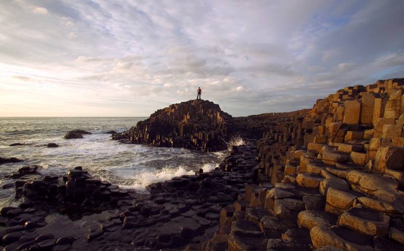 Man standing on top of Giant's Causeway