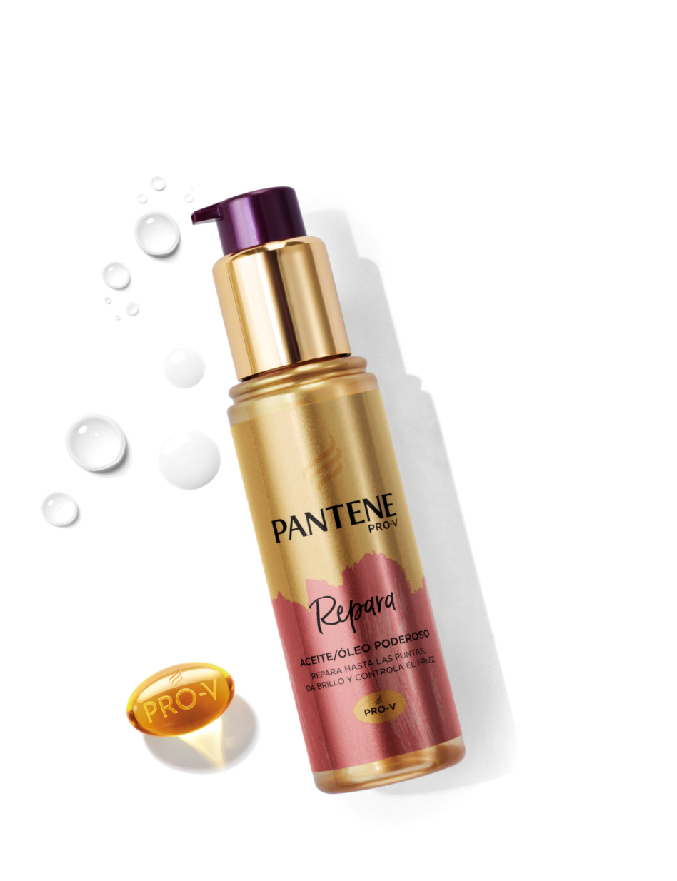 Frasco del Óleo Poderoso para el cabello de Pantene junto a una vitamina Pro-V