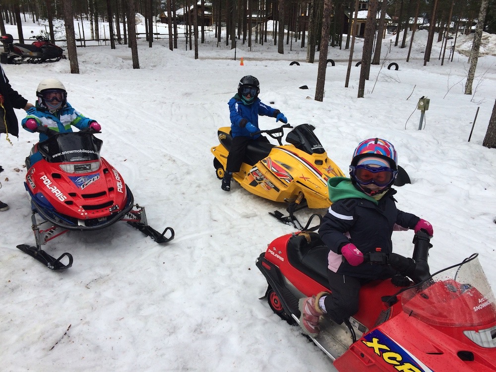 Snowmobiling with kids in Finland