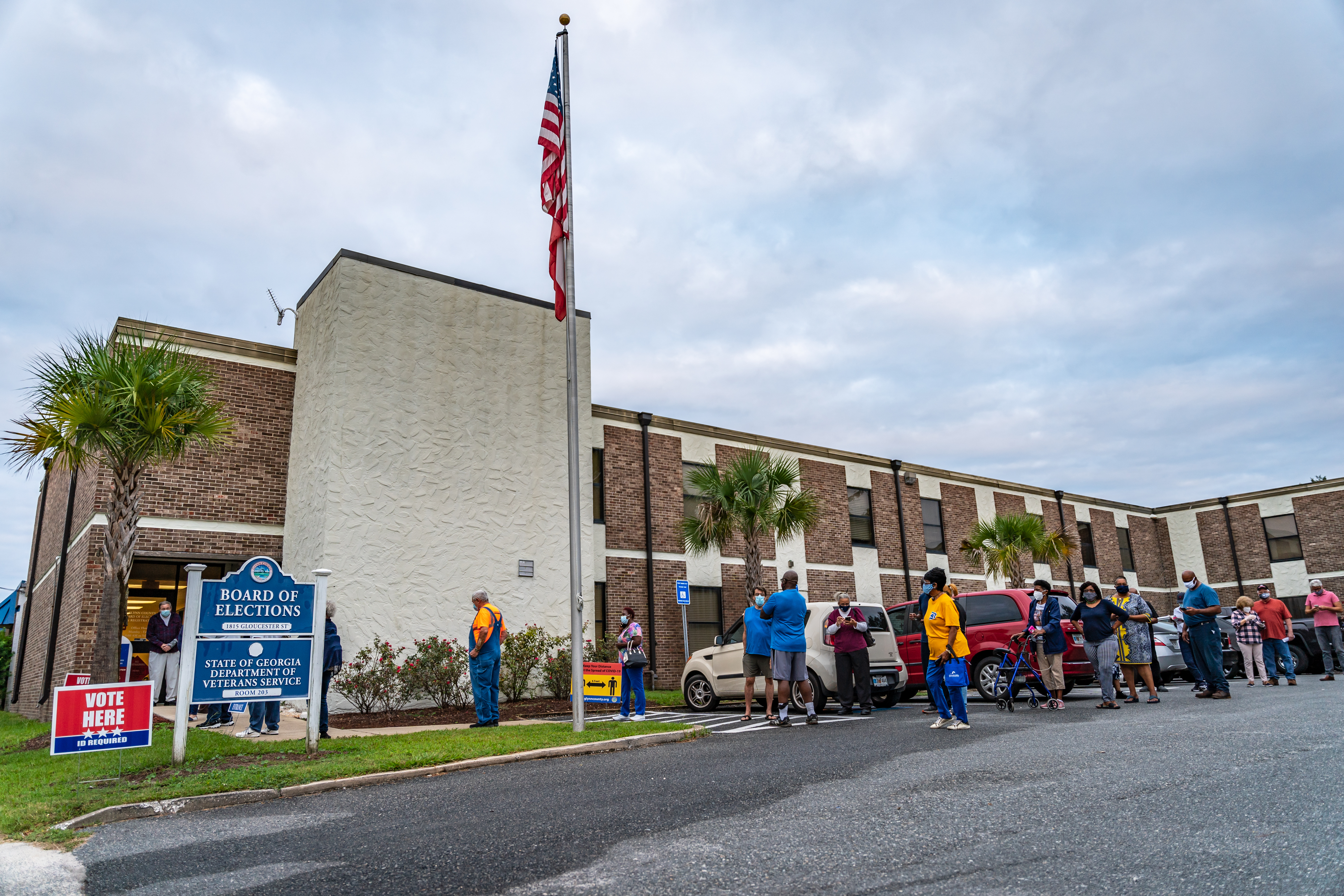 Voters line up outside a Georgia voting center in the 2020 U.S. Presidential election (Shutterstock).