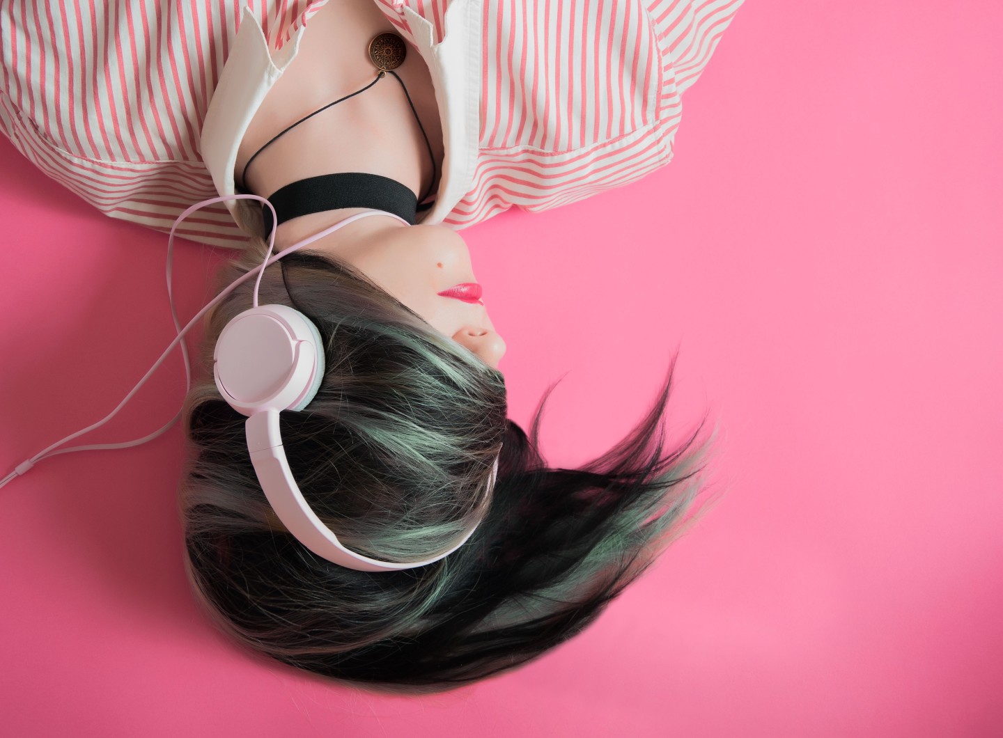 woman pink headphones