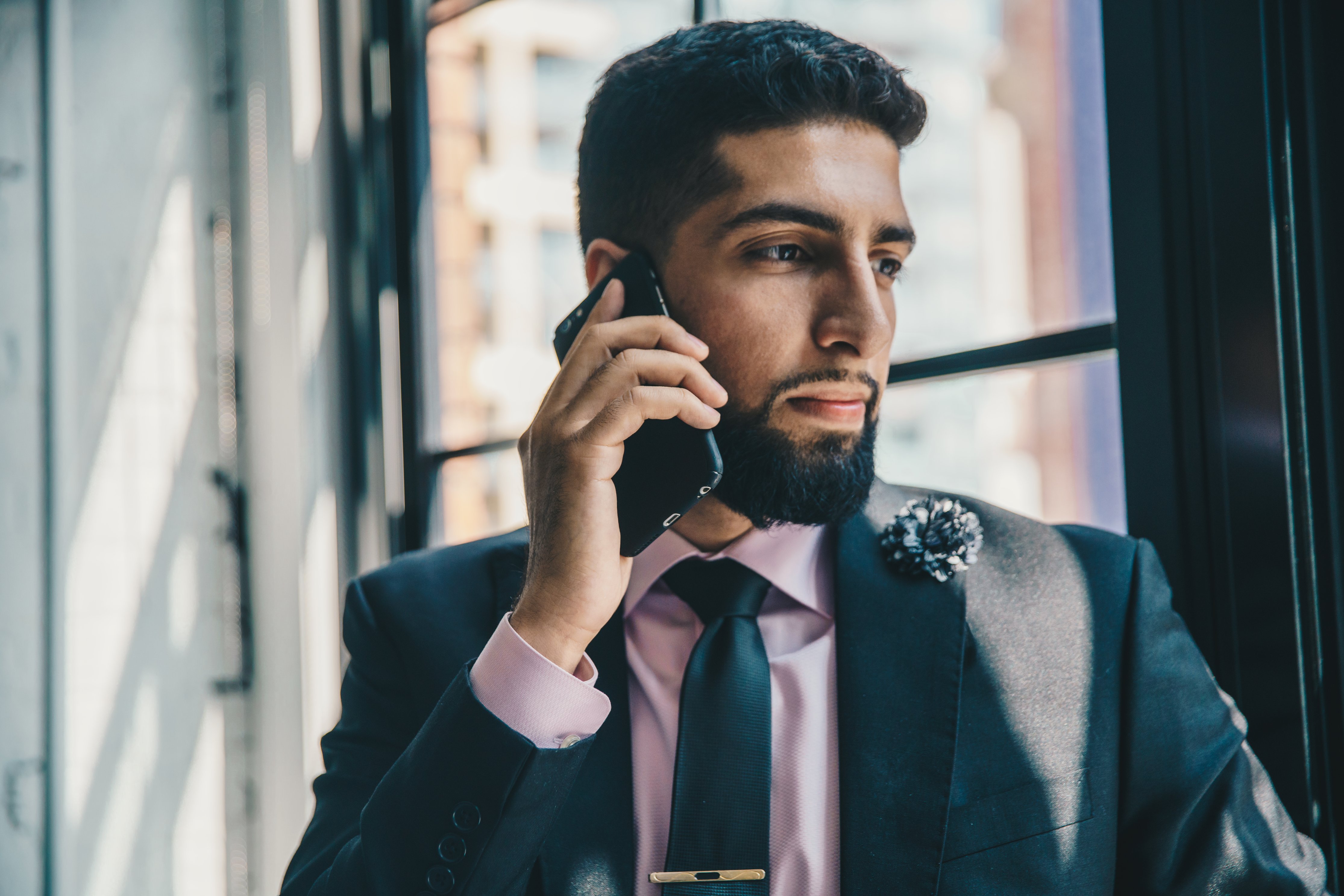 man in suit on phone