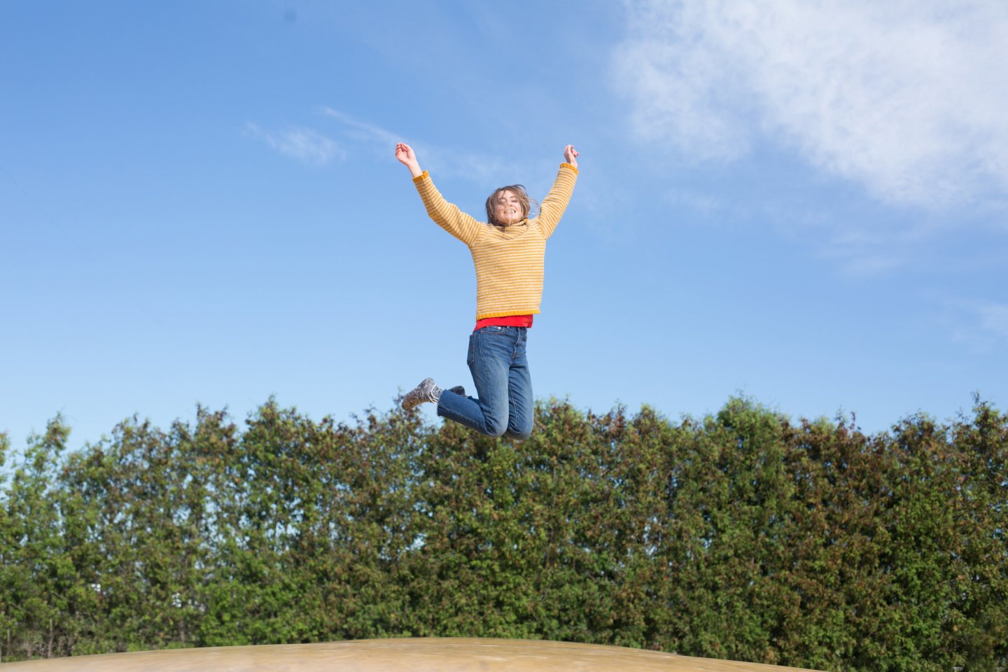 happy-woman-jumps-on-trampoline 4460x4460