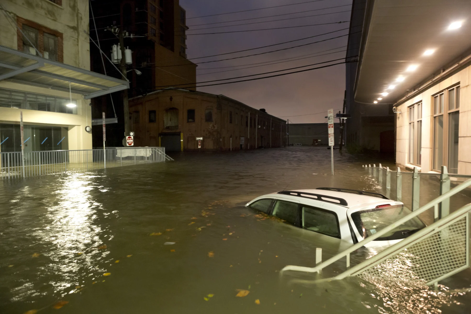 flooding in jersey city, new jersey with a car submerged (Byba Sepit/ DigitalVision/ Getty Images)