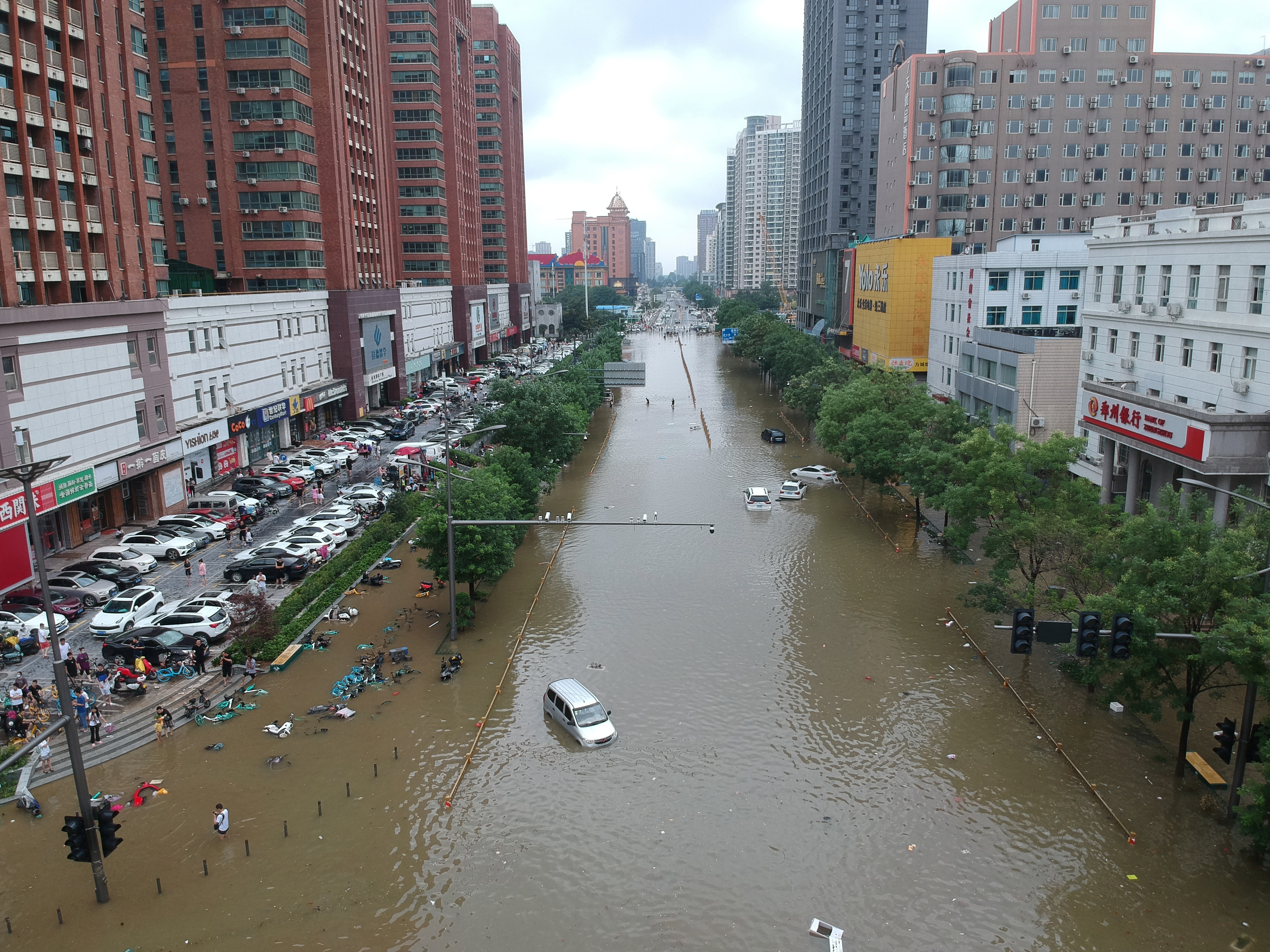 An aerial view shows a flooded road section following heavy rainfall in Zhengzhou, Henan province, China July 21, 2021. Picture taken with a drone. China Daily via REUTERS