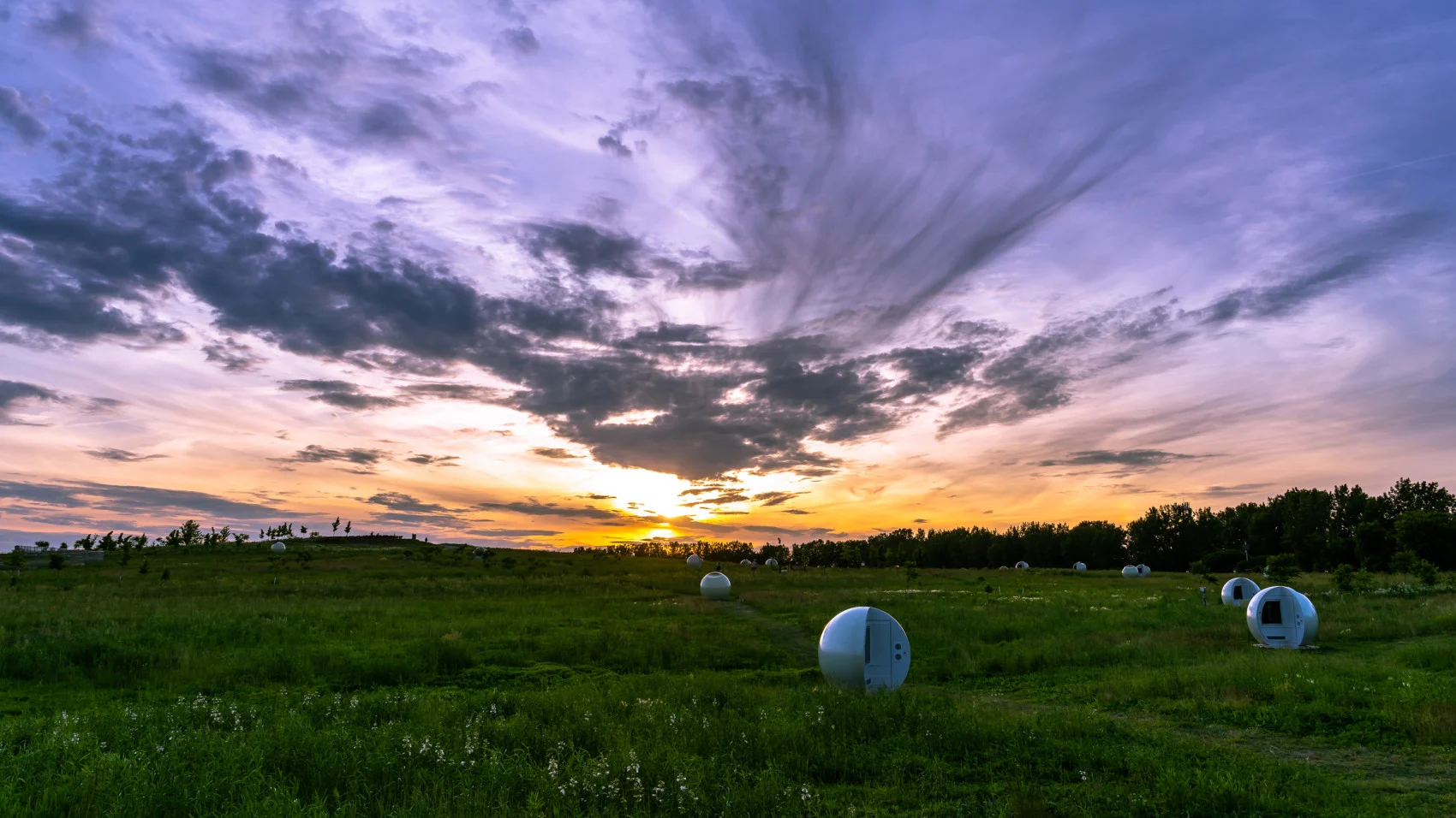 Sunset over biogas capture wells in an open meadow section of Frederic-Back Park in the north Montreal. (Alain Beauchesne/ iStock/ Getty Images Plus)
