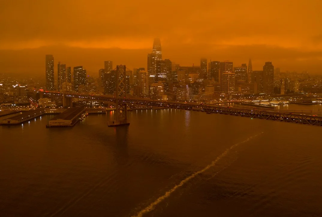 Smoke from the North Complex Fire settles over San Francisco, turning the midday sky a dark orange on September 9