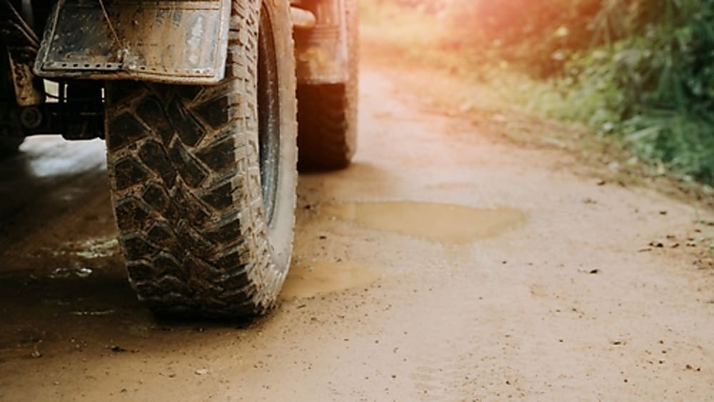 Off-roading on a muddy gravel road