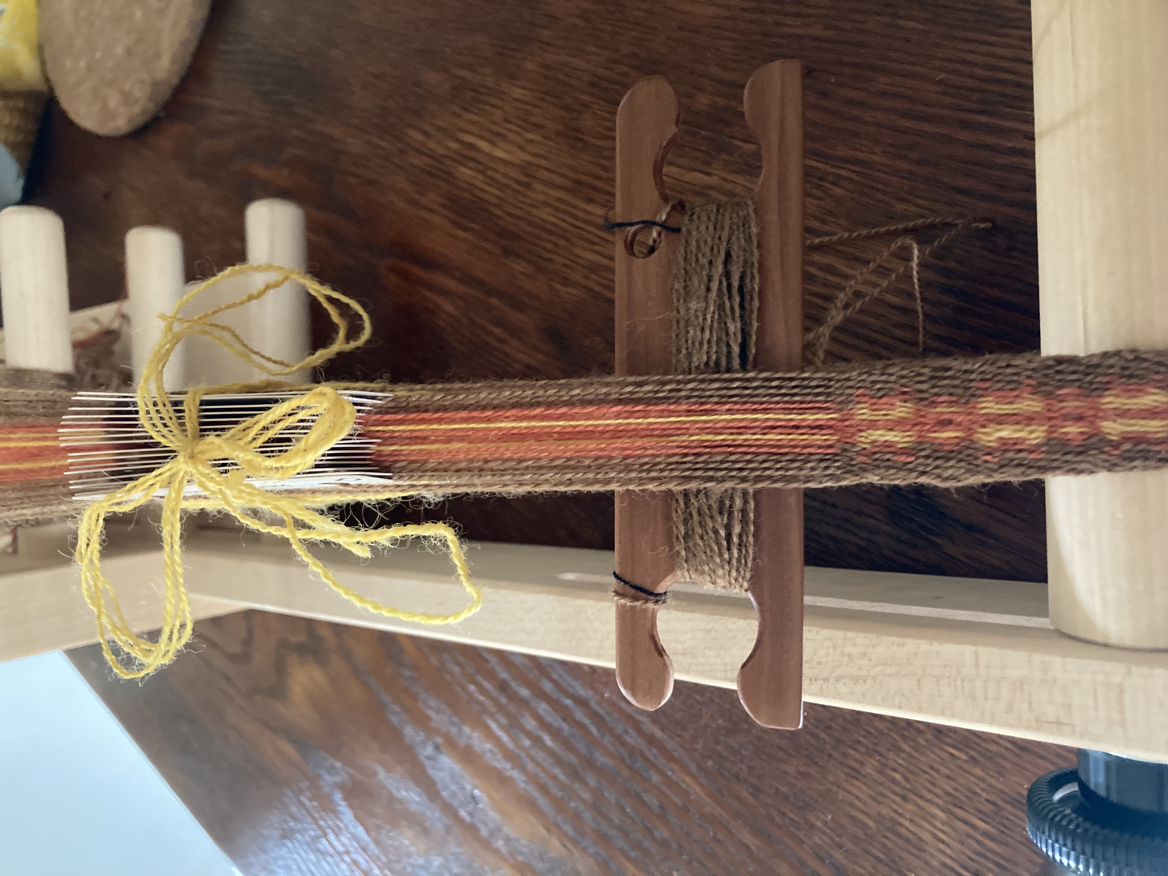 Distaff ribbon on the loom