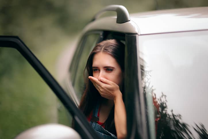 Woman in a car with motion sickness