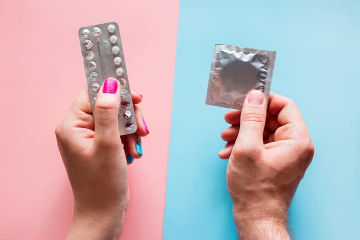 The birth control pill and a condom