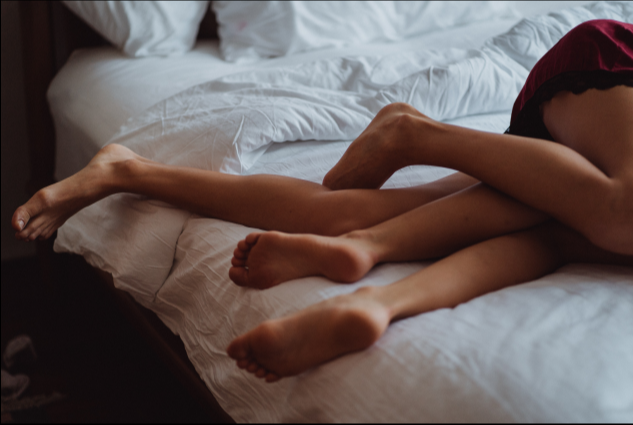 Legs in bed to represent women having orgasm