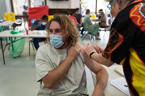 A local resident gets vaccinated at the Aboriginal and Torres Strait Islander pop-up vaccination clinic in Surry Hills. Photo: Abril Felman / City of Sydney
