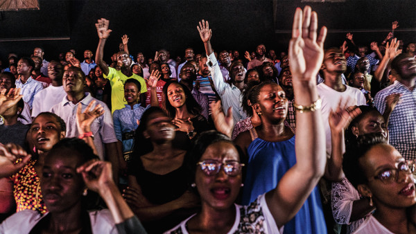 __Sunday service at Watoto, a Pentecostal megachurch in Kampala that hosted Scott Lively in 2009. Activists say Watoto, led by American pastor Gary Skinner, has been instrumental in spreading homophobia in Uganda.__