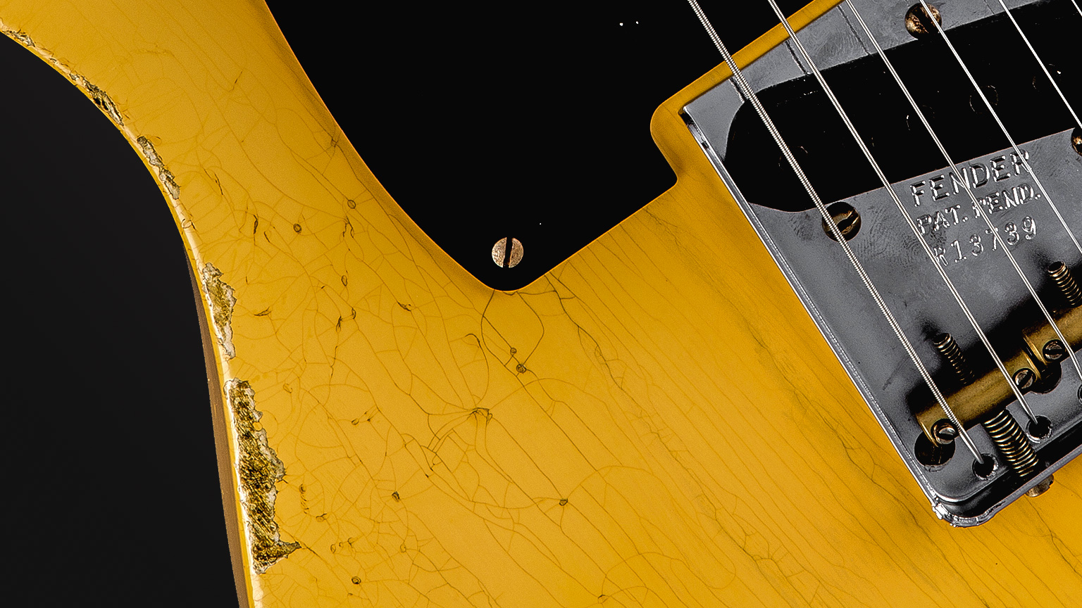 A close-up of finish checking on a Fender Custom Shop 1952 Heavy Relic® Telecaster® guitar.