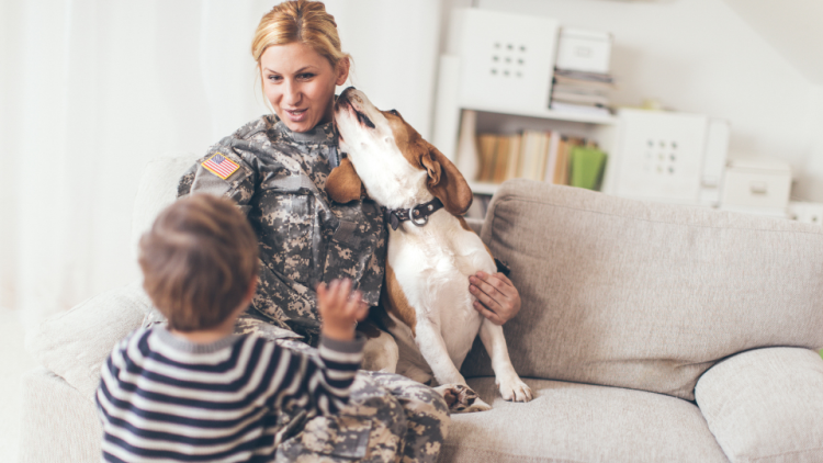 female soldier with dog and son