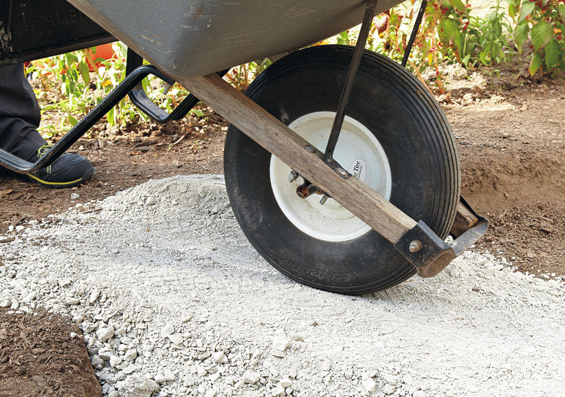 di-how-to-install-patio-step3: Spread 3 inches of gravel as a base for the pavers.