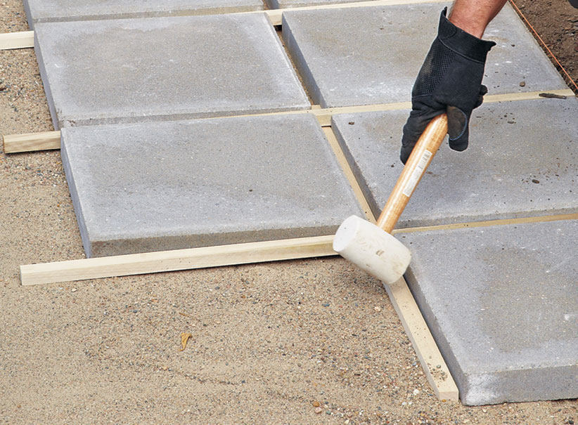 di-how-to-install-patio-step7: A spacer grid makes it easier to keep the patio square.