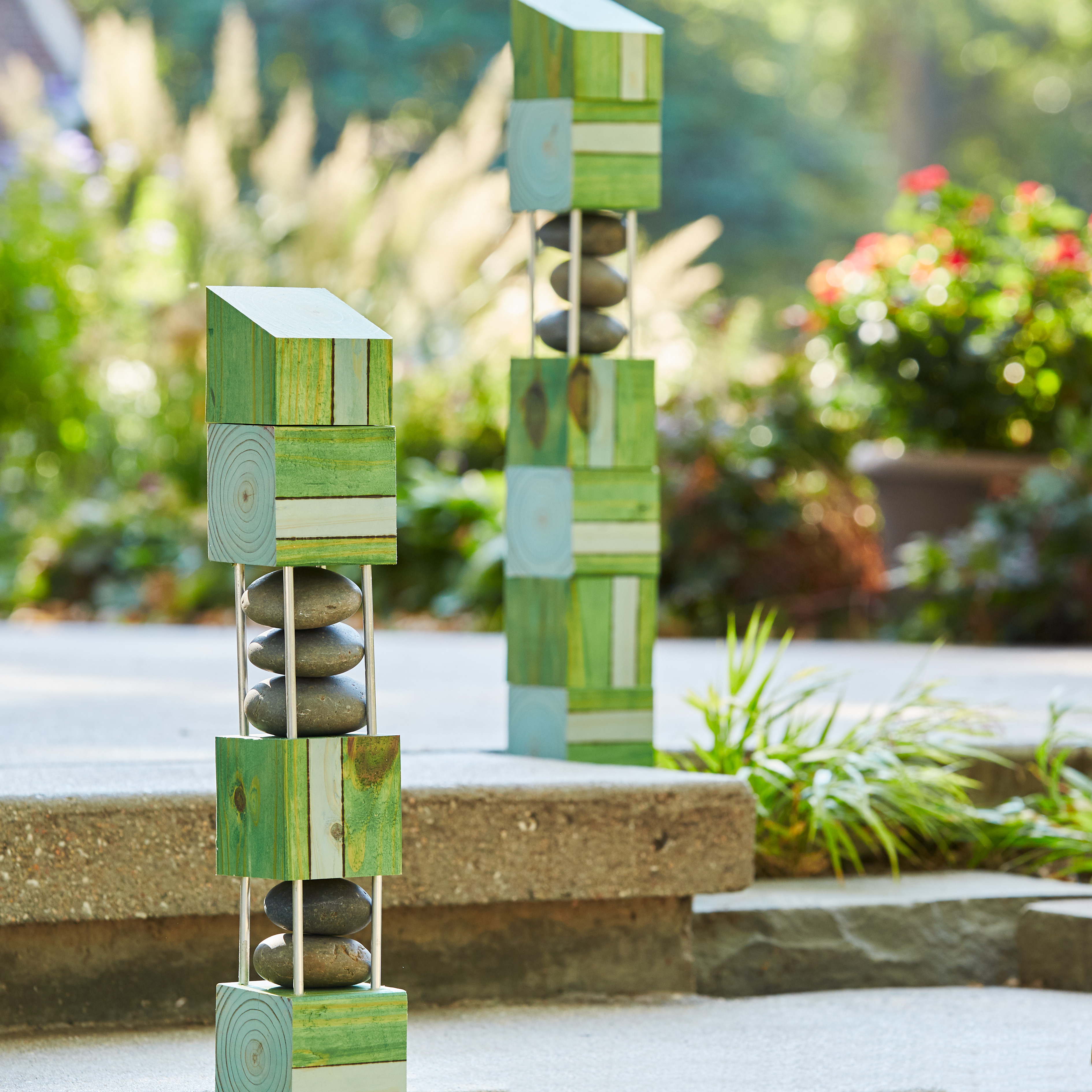 diy-garden-poles-block-design: A pair of garden poles help define the offset steps to prevent a stumble.