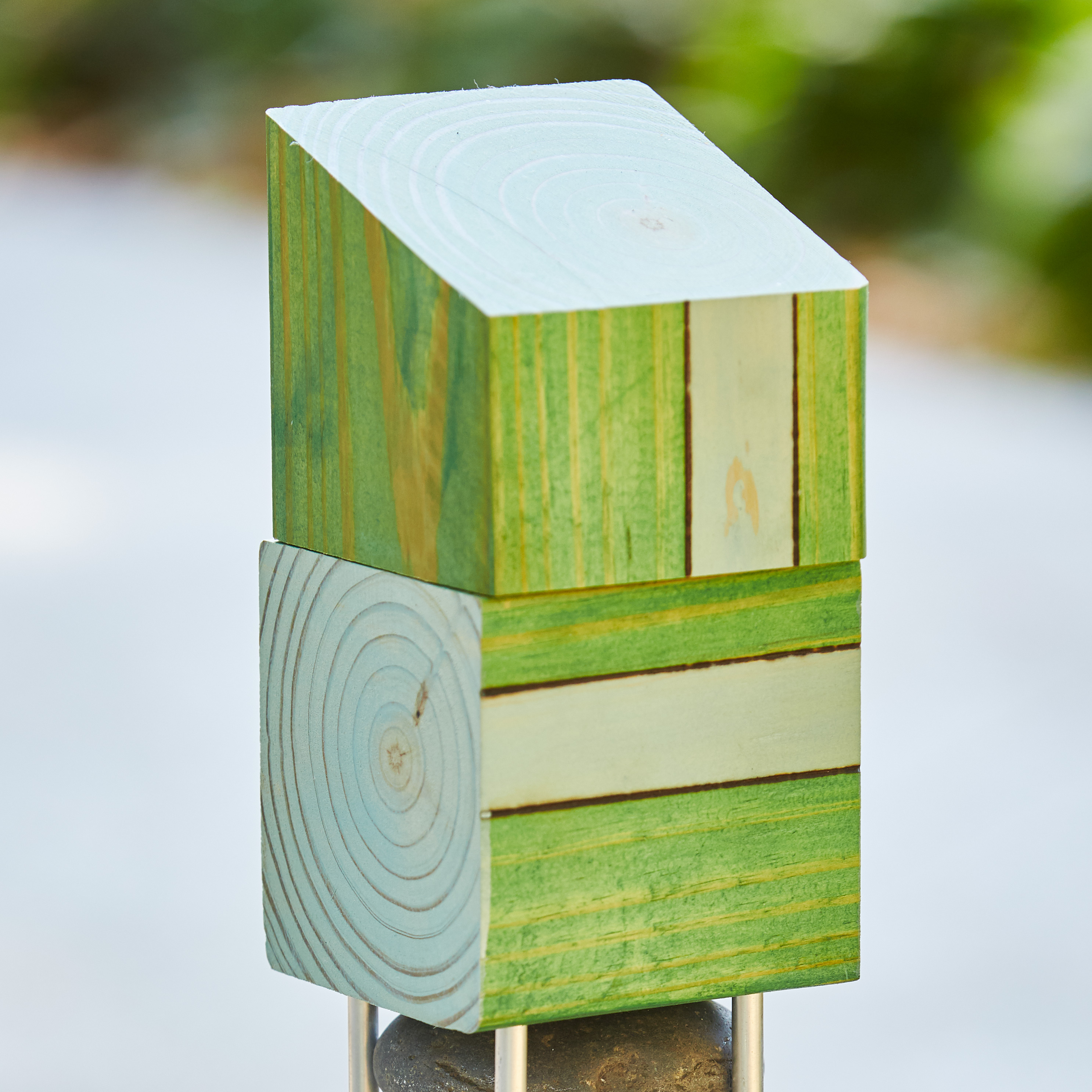 diy-garden-poles-topper: Semi-transparent stain allows wood grain to show through the top and exposed sides.