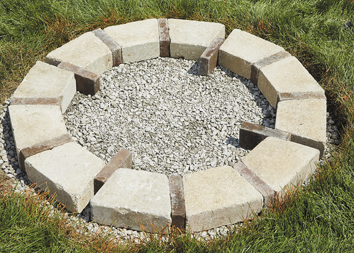 DIY firepit7:Leave these four pavers only partially removed. They help hold the blocks in place and are easy to remove later.