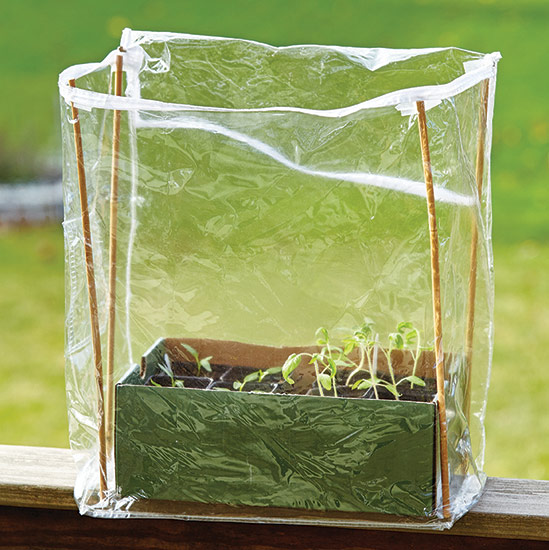ht-ss-successfully-start-seeds-4: Bamboo stakes give structure to the sides of the bag, and cardboard holds the bottom open and flat.
